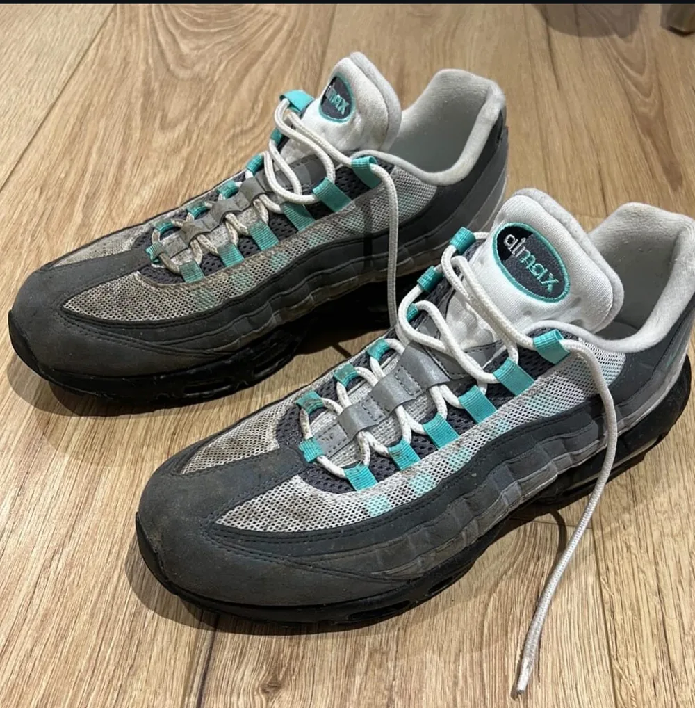 The same pair of Air Max 95s on arrival, dirty from a festival