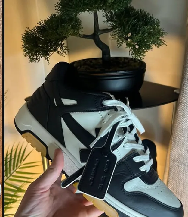 Off-White Out of Office trainers in black and white with the zip tie tag